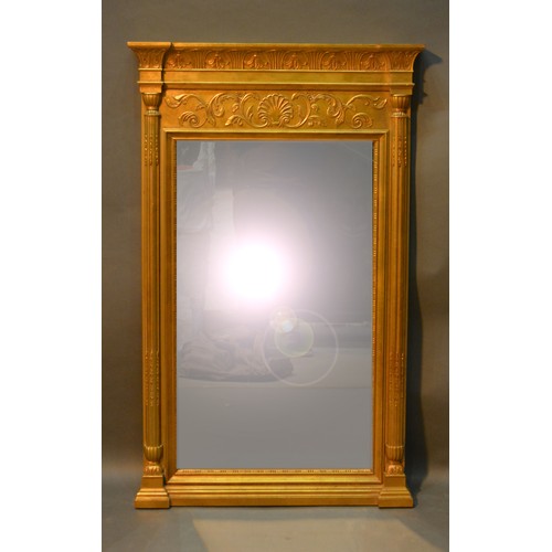 533 - A Gilt Framed Wall Mirror of Rectangular Form with a frieze decorated in relief above a rectangular ... 