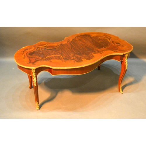 534 - A French Marquetry Inlaid and Gilt Metal Mounted Coffee Table, the shaped top above cabriole legs wi... 