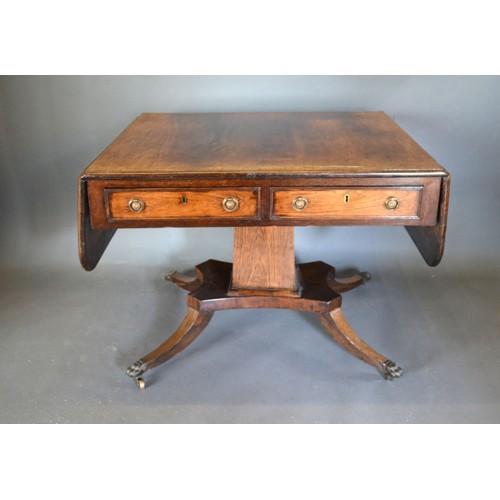 537 - A Regency Rosewood Brass Inlaid Sofa Table, the two frieze drawers opposed by dummy drawers with cir... 