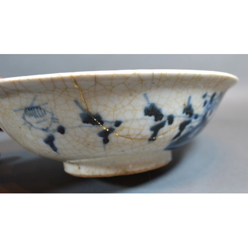 80 - An Early Chinese Crackleware Underglaze Blue Decorated Bowl, 21 cms diameter