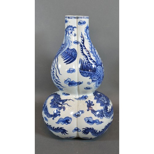 84 - A 19th Century Chinese Porcelain Gourd Vase of Triform decorated in underglaze blue with serpents, b... 