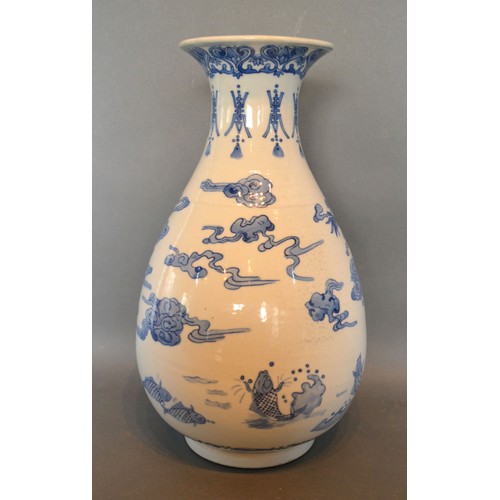 85 - A 19th Century Chinese Porcelain Vase of Oviform decorated in underglaze blue with serpents and fish... 