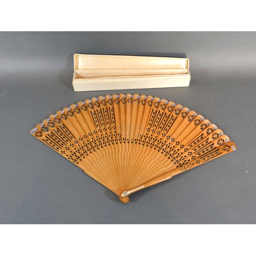 286 - A late 18th Century English Carved and Pierced Wooden Brise Fan with oval engraving depicting a fema... 