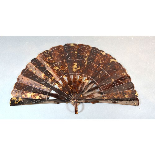 288 - A Victorian Tortoiseshell Brise Fan with carved and pierced sticks and guards 20cm