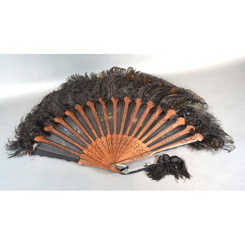 292 - An Early 19th Century Carved Wooden Lace and Feather Fan with carved and pierced sticks and guards a... 