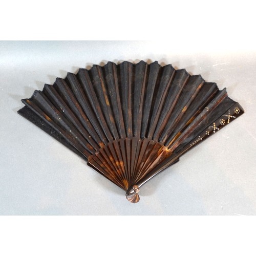 294 - A Tortoiseshell and Black Gauze Fan with gilded decorated tortoiseshell sticks and guards and black ... 