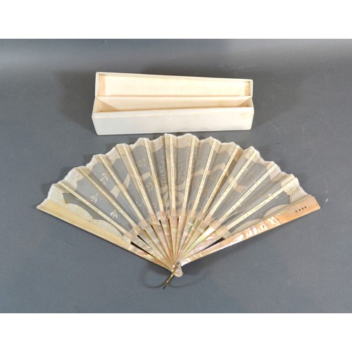 295 - A Mother-Of-Pearl and Gauze Leaf Fan with sequin decorated mother-of-pearl guards and sticks and wit... 