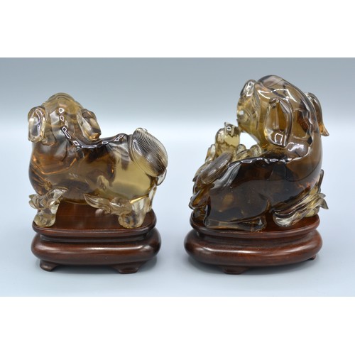 395 - A Pair of Early 20th Century Chinese Rock Crystal Models in the form of Foe Dogs, each with a hardwo... 