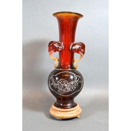 398 - An Early 20th Century Chinese Amber Resin Vase with hardwood stand, 24 cms tall