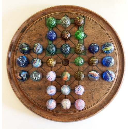 408 - A Collection of Victorian Marbles complete with Solitaire board and an early Ludo box