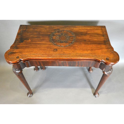 543 - A George III Mahogany Card Table, the shaped hinged top above a plain frieze, raised upon turned tap... 