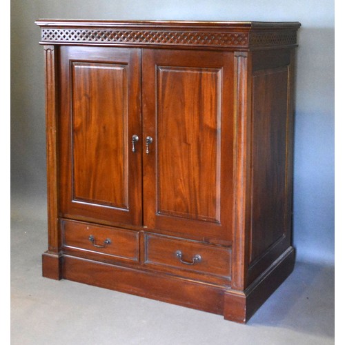 545 - A 20th Century Hardwood Side Cabinet with two panel doors above two drawers raised upon a plinth bas... 