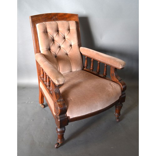 546 - A Victorian Mahogany Drawing Room Armchair with button upholstered back above a stuff over seat rais... 