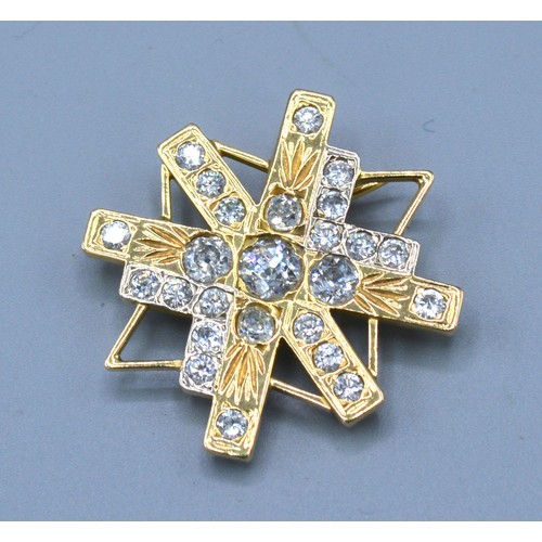 198 - An 18ct. Gold Diamond Set Brooch of Abstract Star Form, the central diamond approximately 0.40 ct. s... 