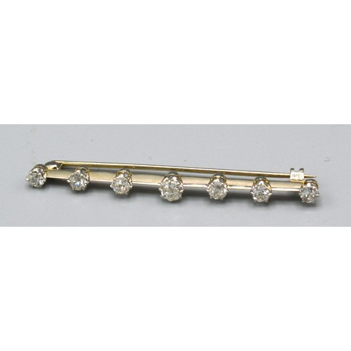 199 - A White Metal Diamond Set Bar Brooch with a central diamond approximately 0.20 ct. flanked by six fu... 