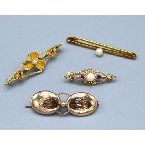 203 - A 9ct. Gold Pearl Set Bar Brooch together with another similar 9ct. gold brooch, a 15ct. gold bar br... 