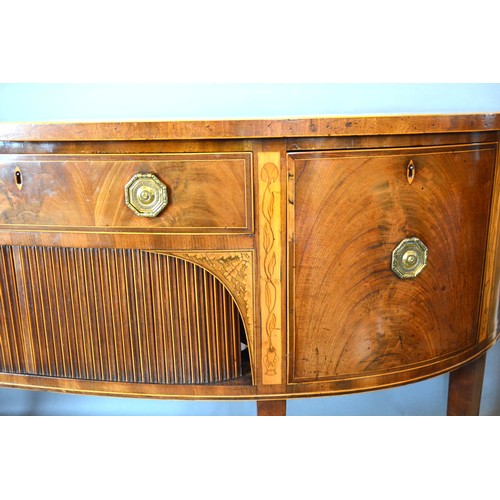 526 - A Regency Mahogany Demi-Lune Sideboard, the line inlaid top above a central drawer and tambour flank... 