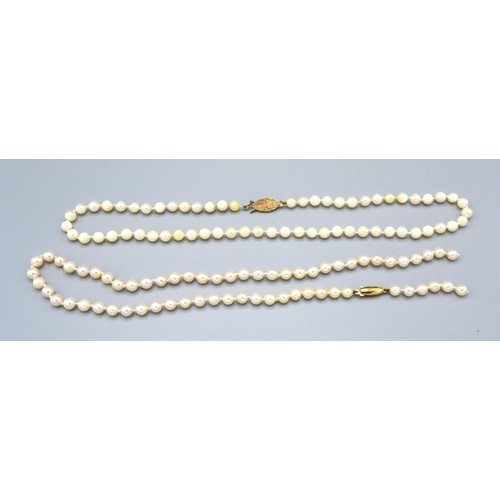 230 - A Cultured Pearl Necklace with 9ct. Gold Clasp, 43 cms long together with another similar cultured p... 