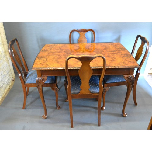 377 - A Burr Walnut Queen Anne Style Dining Room Suite comprising an extending dining table with single ex... 