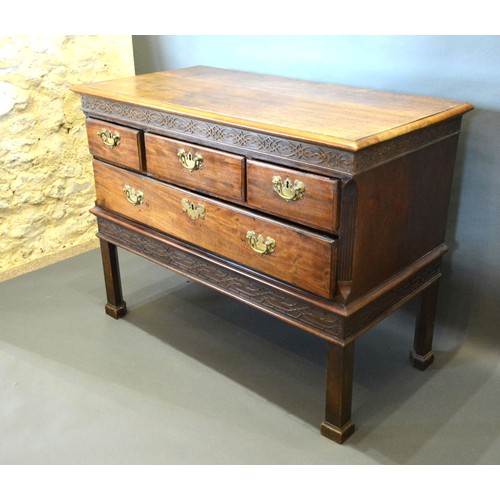 400 - A 19th Century Mahogany Low Chest, the moulded top above a blind fretwork frieze and four drawers wi... 