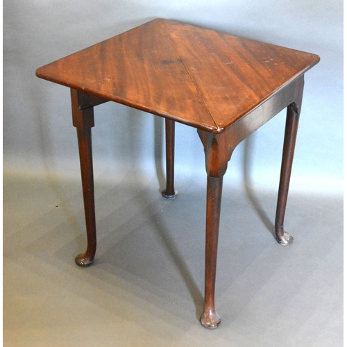 403 - A 19th Century Mahogany Card Table of Triangular Form, the hinged top above a drop flap raised upon ... 