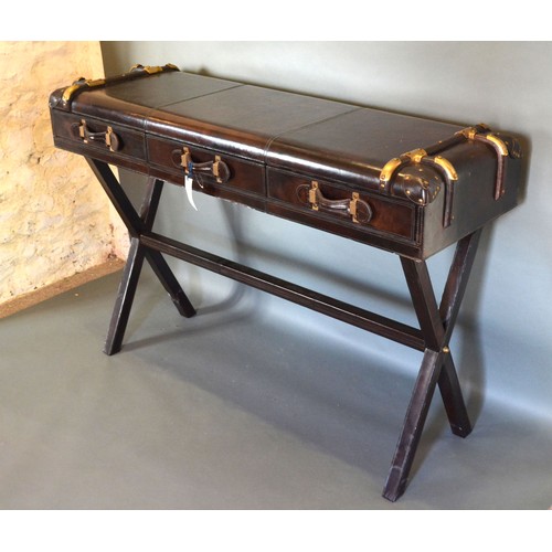 415 - A 20th Century Side Table in the form of a Suitcase with three drawers raised upon crossover legs wi... 