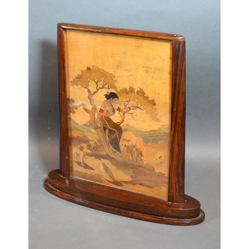 276 - An Art Deco Rosewood Table Screen with marquetry inlaid panel depicting a lady with sheep within a l... 