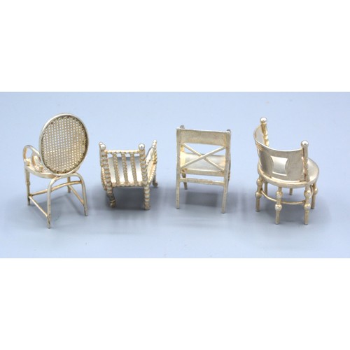 154 - Four Birmingham Silver Miniature Model Chairs ranging from 4 to 6 cms tall, maker's mark L&S