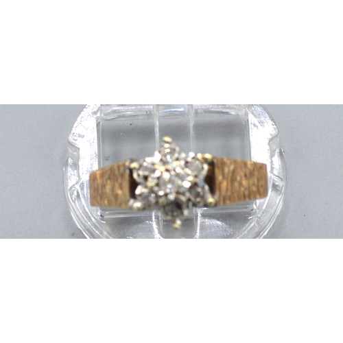 168 - A 9ct Yellow Gold Diamond Cluster Ring with central diamond surrounded by diamonds within a star set... 