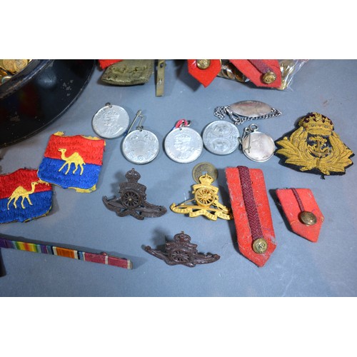 281 - A Large Collection of Military Brass Buttons, Badges, Cloth Badges and Medals