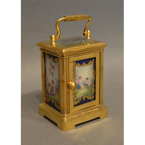 353 - A Miniature Brass Cased Carriage Clock the silvered dial with roman numerals and with painted porcel... 