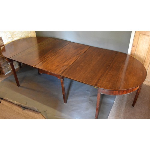 474 - A 19th Century Mahogany Extending Dining Table with centre drop flap table and with a pair of demi-l... 