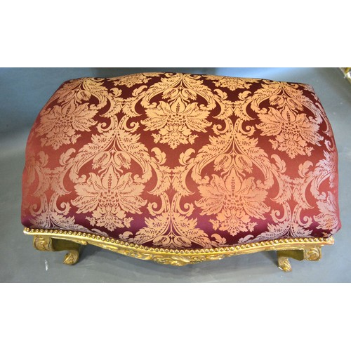 480 - A French Style Large Gilded Stool, the burgundy upholstered top above a carved frieze raised upon ca... 