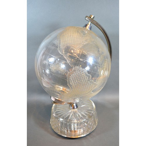 3 - A Waterford Crystal World Globe with cut-glass decoration within chromium support upon a cut-glass c... 