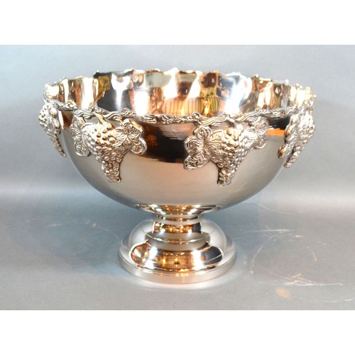 90 - A silver plated large pedestal punch bowl, decorated in relief with grape vine, 38.5cms diameter, 26... 