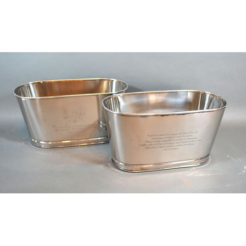 100 - A pair of Champagne coolers bearing script relating to Bollinger, 29.5cms long