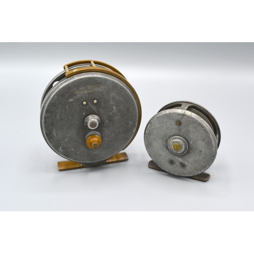 200 - An Army and Navy fishing reel, 9cms diameter, together with another similar by Army and Navy, 7cms d... 