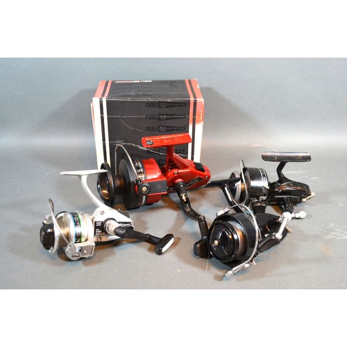 214 - An ABU Garcia Cardinal 558 fishing reel together with another Shakespeare Alpha 040, and two Garcia ... 