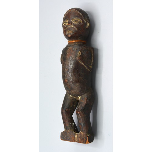 269 - An early African carved figure, 20cms long