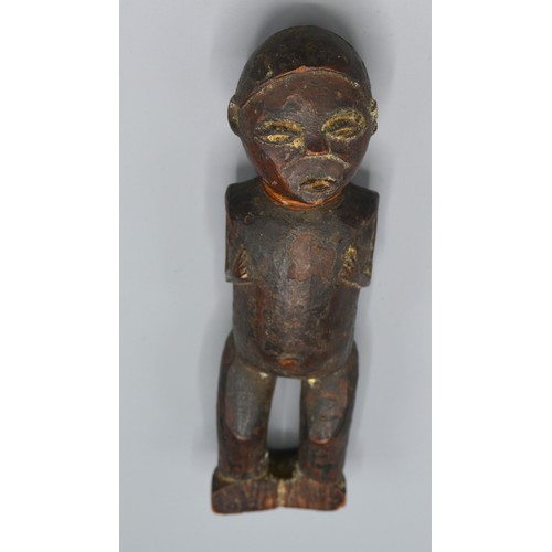 269 - An early African carved figure, 20cms long