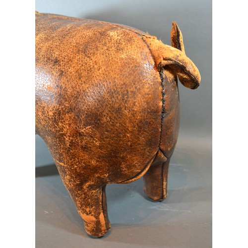 275 - Dimitri Omersa for Liberty of London, a leather footstool in the form of a pig, 64cms long,