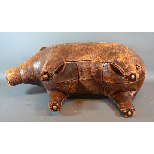 275 - Dimitri Omersa for Liberty of London, a leather footstool in the form of a pig, 64cms long,