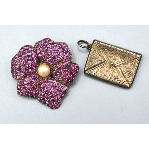 149 - *** Collect*** A White Metal Brooch in the form of a flower head encrusted with pink stones with cen... 