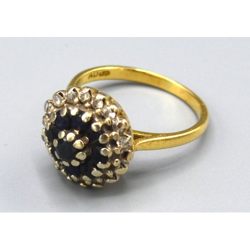 150 - An 18ct Gold Sapphire and Diamond Cluster Ring with a central cluster of sapphires surrounded by dia... 