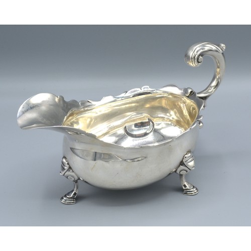 163 - A George II Silver Sauce Jug with shaped scroll handle and three hoof supports, London 1746, 12 ozs.