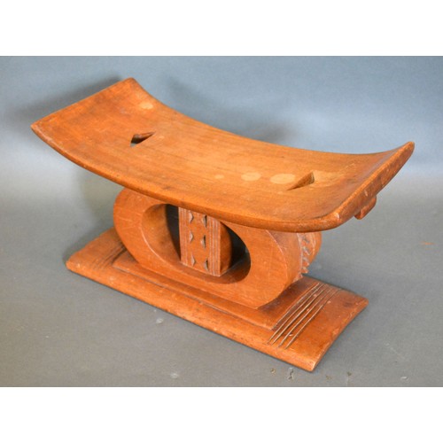 304 - An African Carved Hardwood Headrest of Shaped Form 36.5 cms long x 17.5 cms and 20 cms high