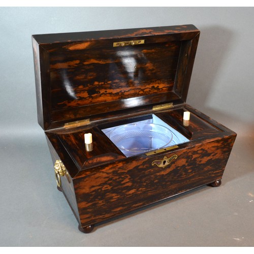 285 - A 19th century coromandel tea caddy, the hinged cover enclosing a blending bowl and two compartments