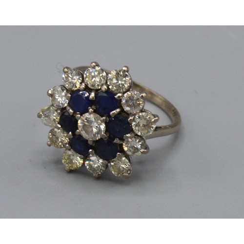 117 - An 18ct white gold diamond and Sapphire cluster ring, claw set, ring size N, 5.2g