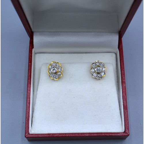 123 - A pair of yellow gold diamond cluster ear studs, each with a central diamond surrounded by diamond w... 