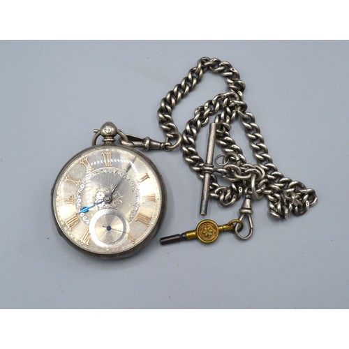 131 - A London silver cased pocket watch, the engraved dial with Roman numerals and with curb link watch c... 